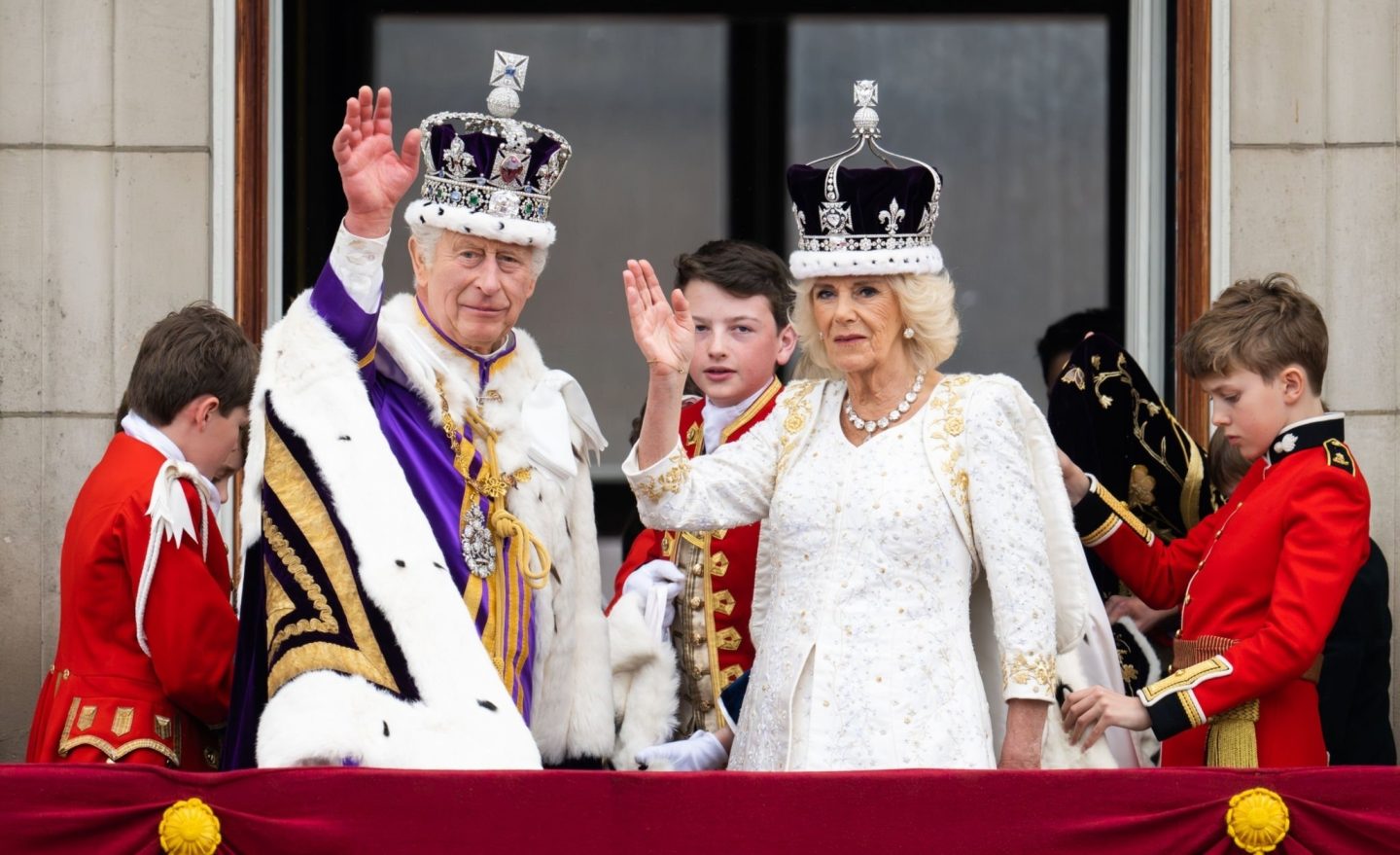 Picture of King Charles III and his wife wearing crowns containing disputed precious stones